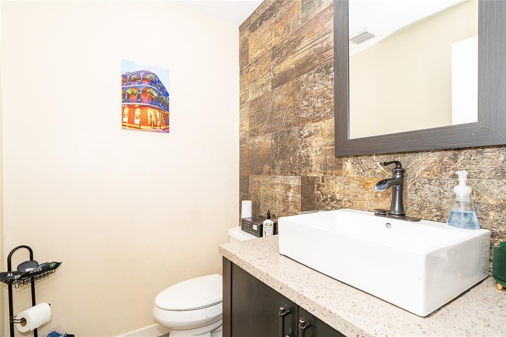 2350 Wekiva Ridge Road Apopka, FL 32712 - Photo 25 of 34 a bathroom with a sink a toilet and a mirror