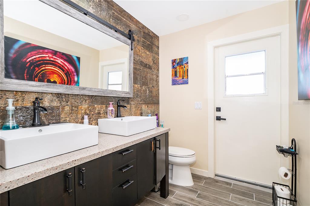 2350 Wekiva Ridge Road Apopka, FL 32712 - Photo 28 of 34 a bathroom with a sink a toilet and shower