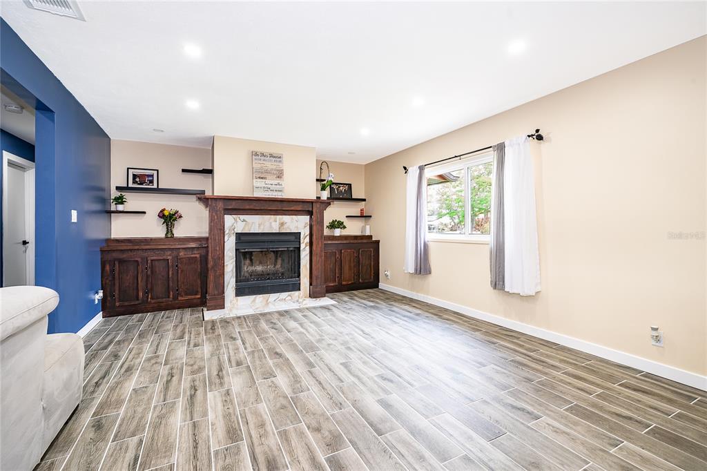 2350 Wekiva Ridge Road Apopka, FL 32712 - Photo 6 of 34 a view of a livingroom with a fireplace