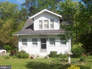 22856 Nanticoke Road Quantico, MD 21856 - Photo 1 of 5 a front view of a house with a yard