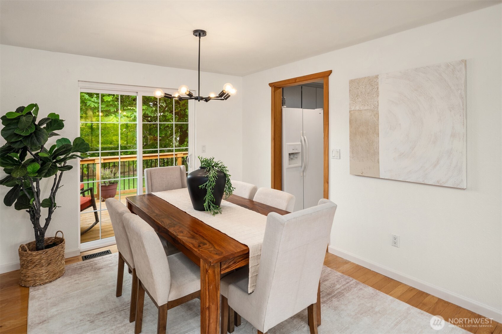 418 212th Street Southwest Bothell, WA 98021 - Photo 12 of 40 a dining room with furniture potted plants and wooden floor
