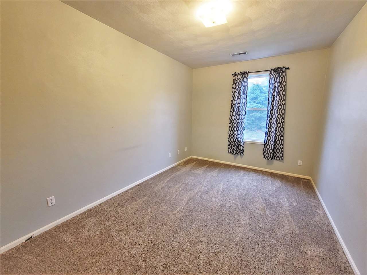 10138 B Monarch Road Roscoe, IL 61073 - Photo 11 of 24 an empty room with windows