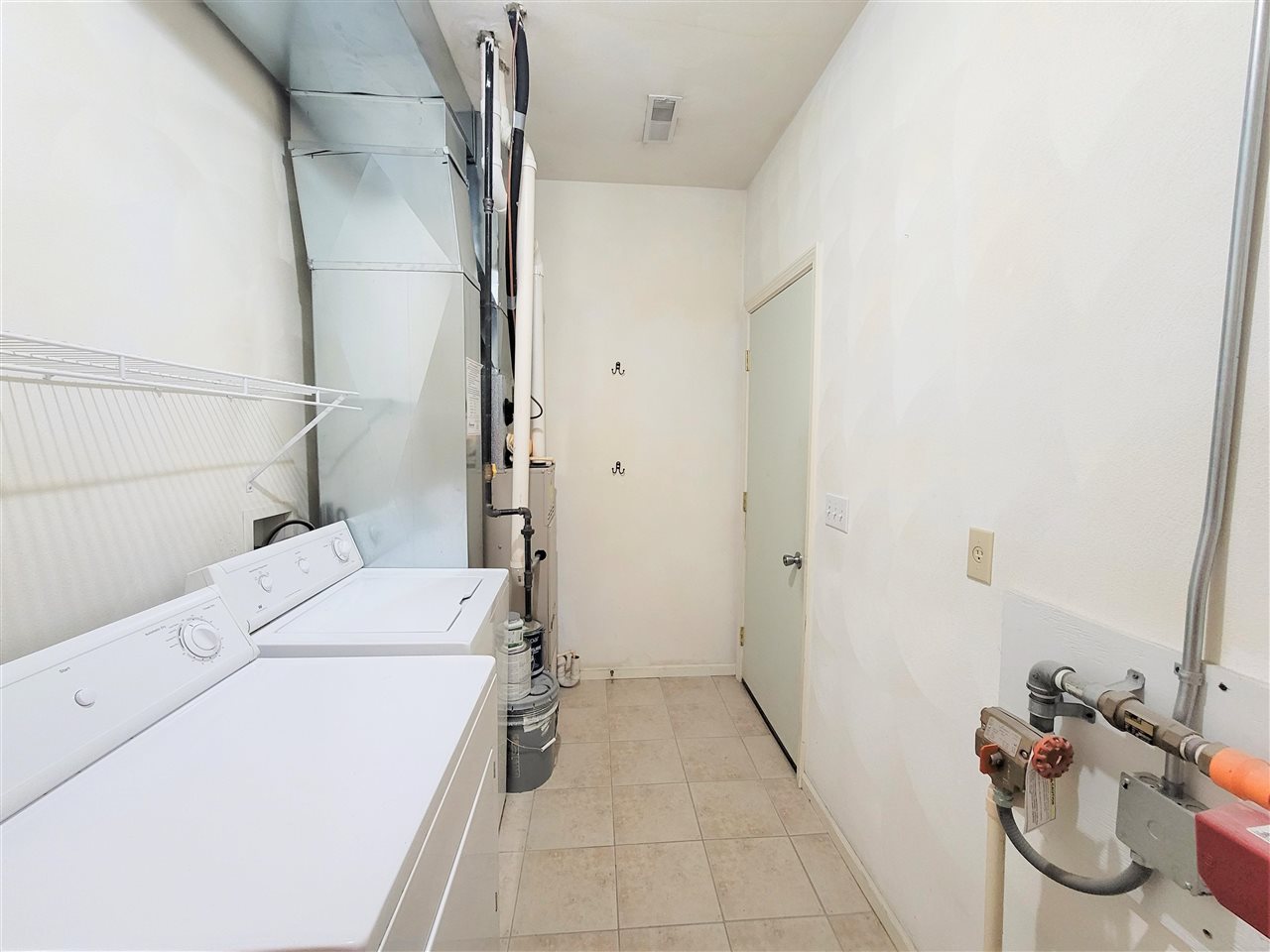 10138 B Monarch Road Roscoe, IL 61073 - Photo 21 of 24 a bathroom with a sink and washing machine
