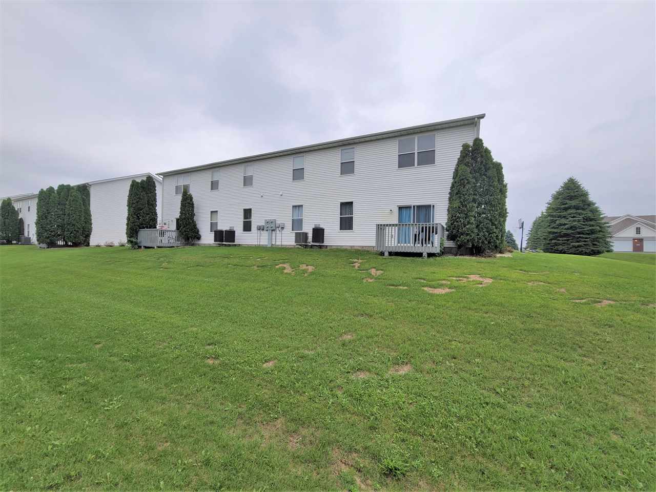 10138 B Monarch Road Roscoe, IL 61073 - Photo 24 of 24 a view of a house with a yard