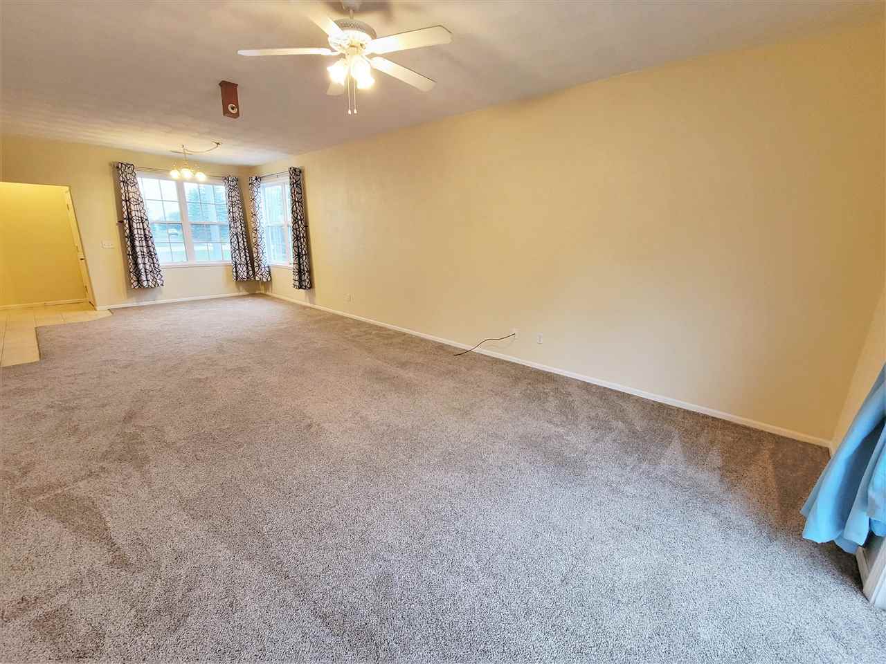 10138 B Monarch Road Roscoe, IL 61073 - Photo 8 of 24 a view of an empty room with a window
