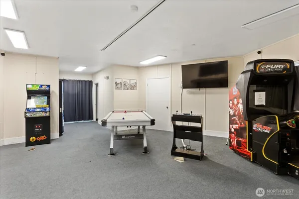 a view of a livingroom with furniture and a flat screen tv