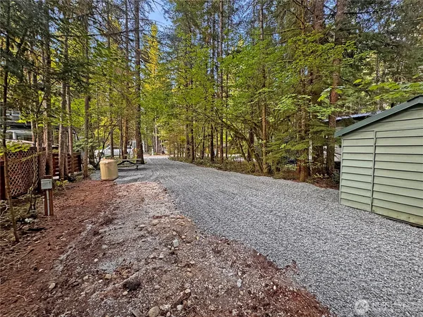 a view of outdoor space with deck and trees