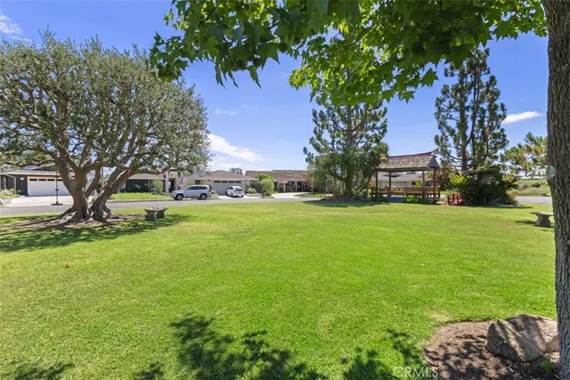 a view of green field with trees