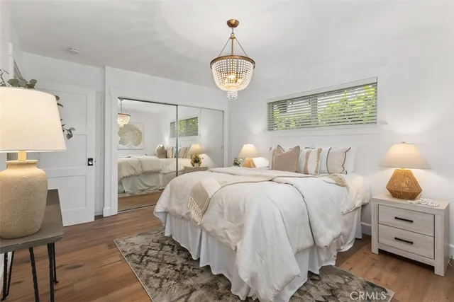 a bedroom with bed and window