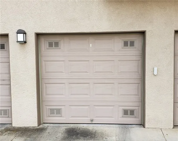 a swimming pool with outdoor seating and plants