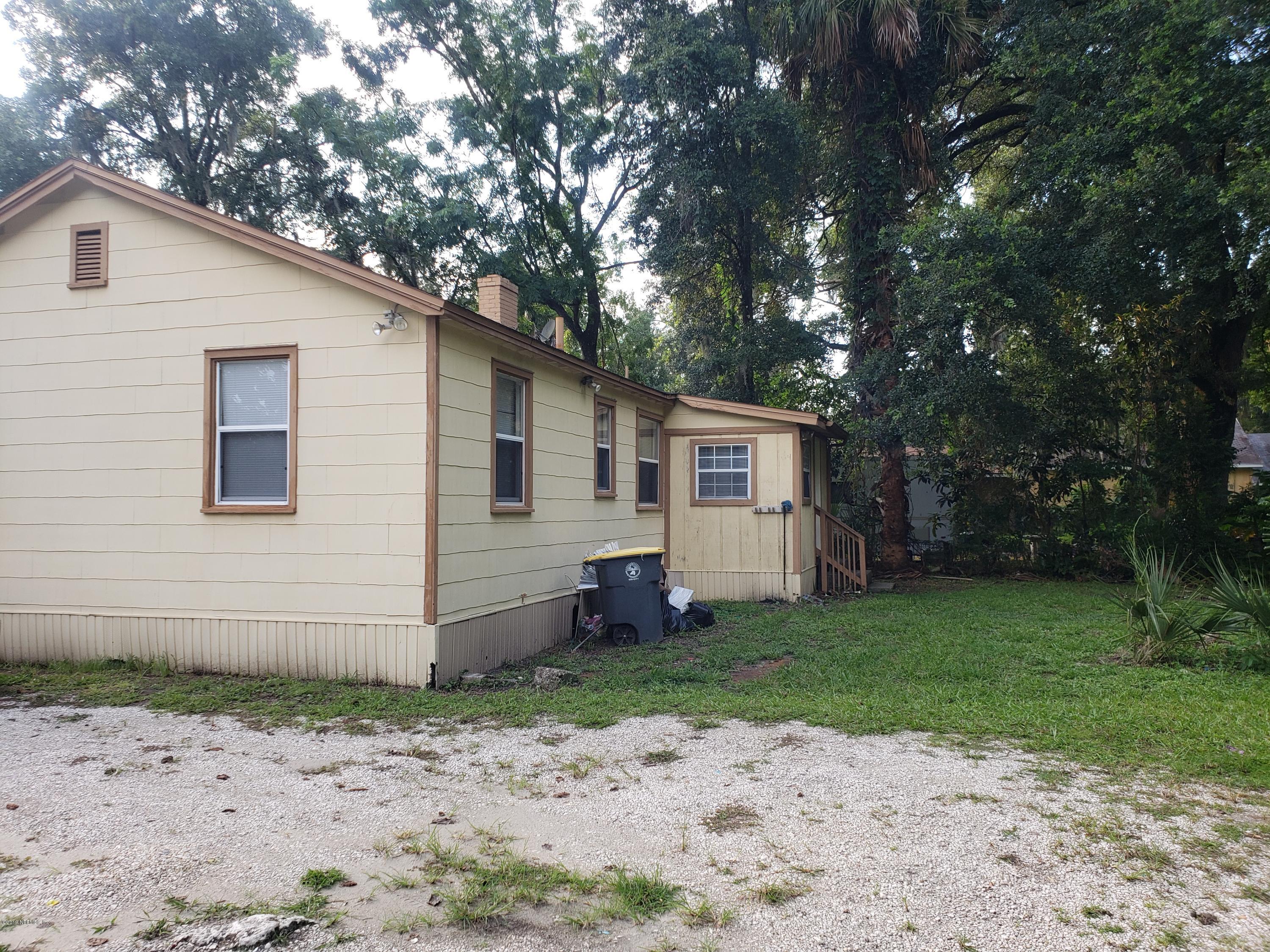3837 St Augustine Road Jacksonville, FL 32207 - Photo 3 of 12 a front view of a house with garden