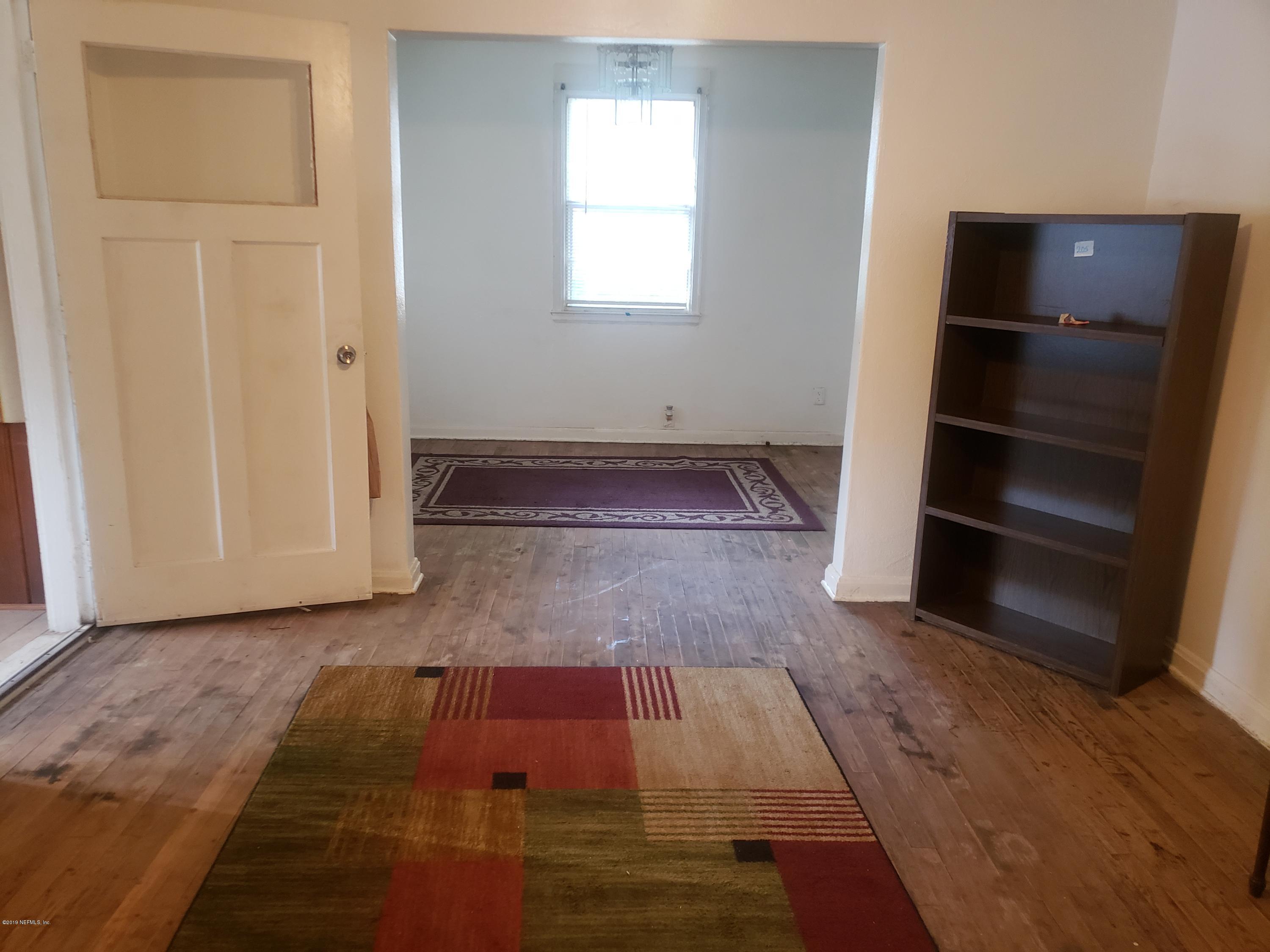3837 St Augustine Road Jacksonville, FL 32207 - Photo 7 of 12 a room with wooden floor and closet