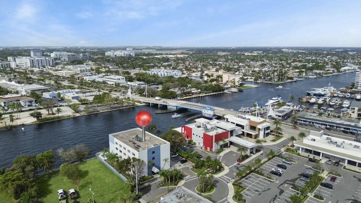 an aerial view of a house with a lake view