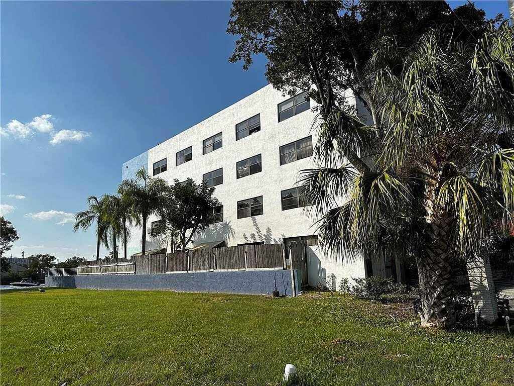 105 South Riverside Drive, Unit 303 Pompano Beach, FL 33062 - Photo 13 of 36 a view of a building with a yard