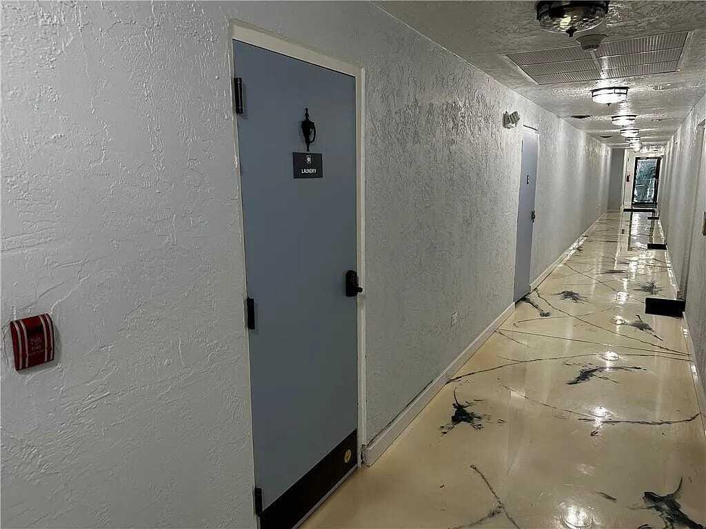 105 South Riverside Drive, Unit 303 Pompano Beach, FL 33062 - Photo 17 of 36 a view of a hallway with entryway