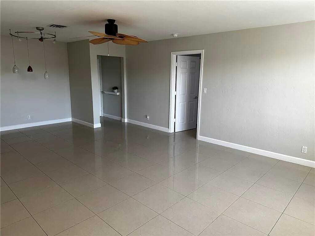 105 South Riverside Drive, Unit 303 Pompano Beach, FL 33062 - Photo 35 of 36 wooden floor in an empty room