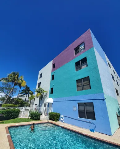 a view of a building with a yard