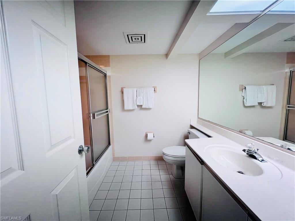 25 Bluebill Avenue, Unit 1002 Naples, FL 34108 - Photo 22 of 34 a bathroom with a sink toilet and shower