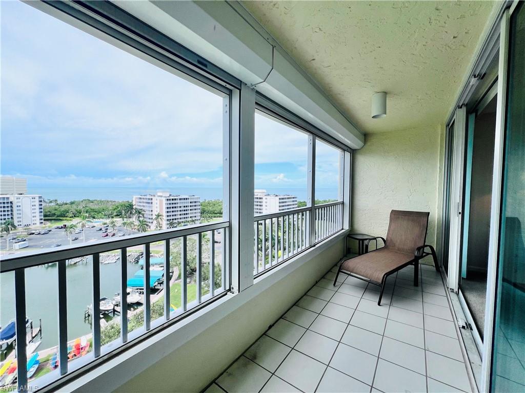 25 Bluebill Avenue, Unit 1002 Naples, FL 34108 - Photo 23 of 34 a view of two chairs in the balcony