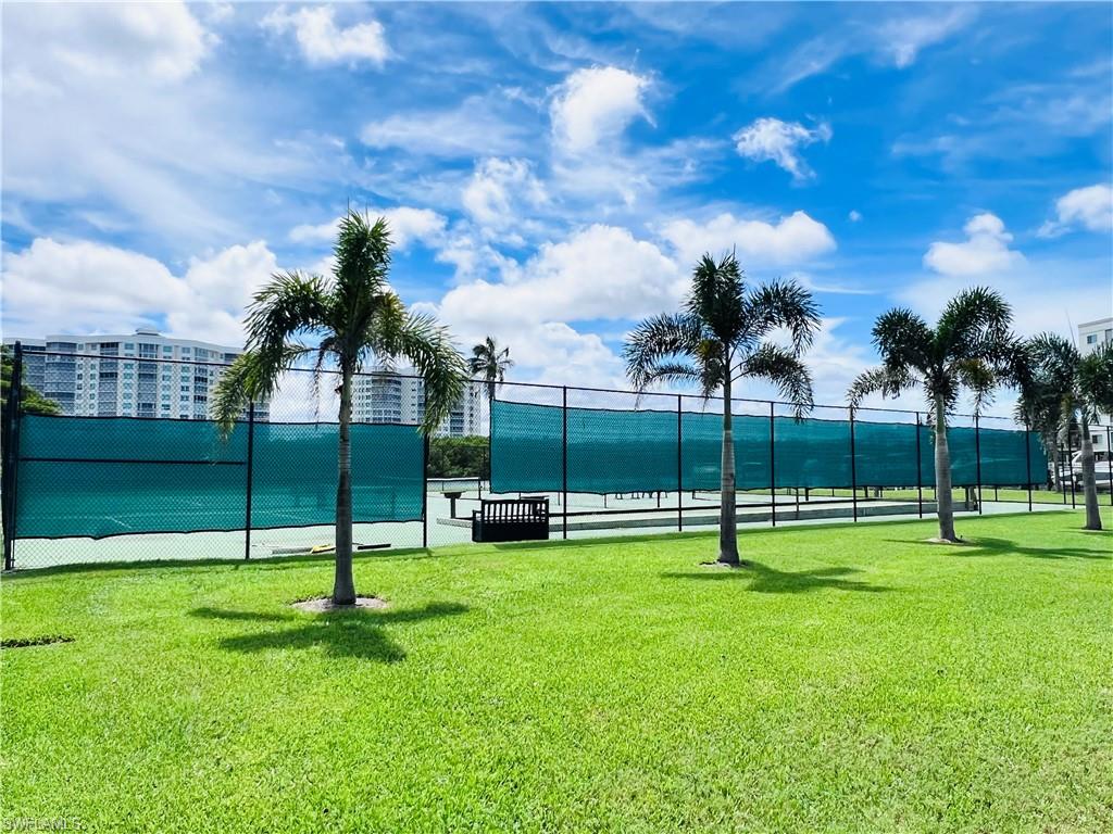 25 Bluebill Avenue, Unit 1002 Naples, FL 34108 - Photo 33 of 34 a view of a park with swings
