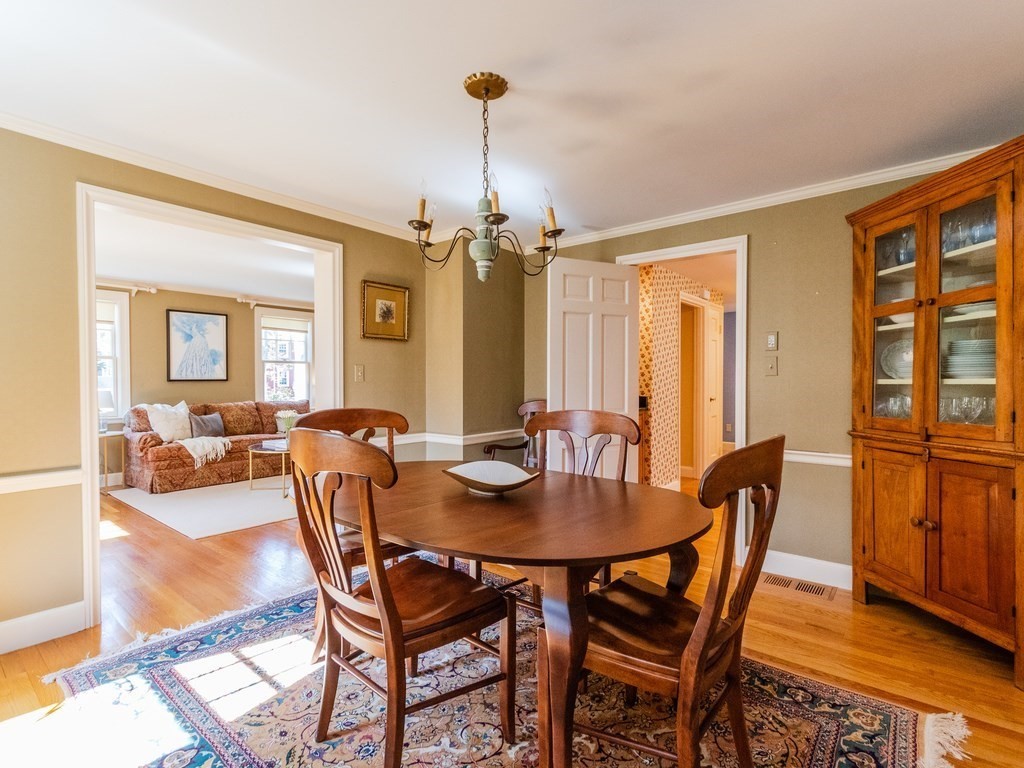 16 Fuller Brook Road Wellesley, MA 02482 - Photo 12 of 36 a view of a dining room with furniture window and wooden floor