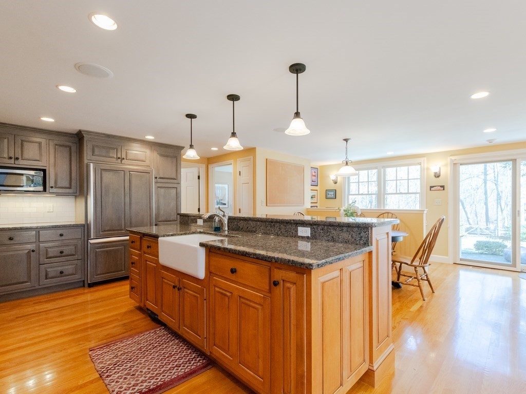 16 Fuller Brook Road Wellesley, MA 02482 - Photo 2 of 36 a kitchen with stainless steel appliances granite countertop a sink a stove and a wooden floors
