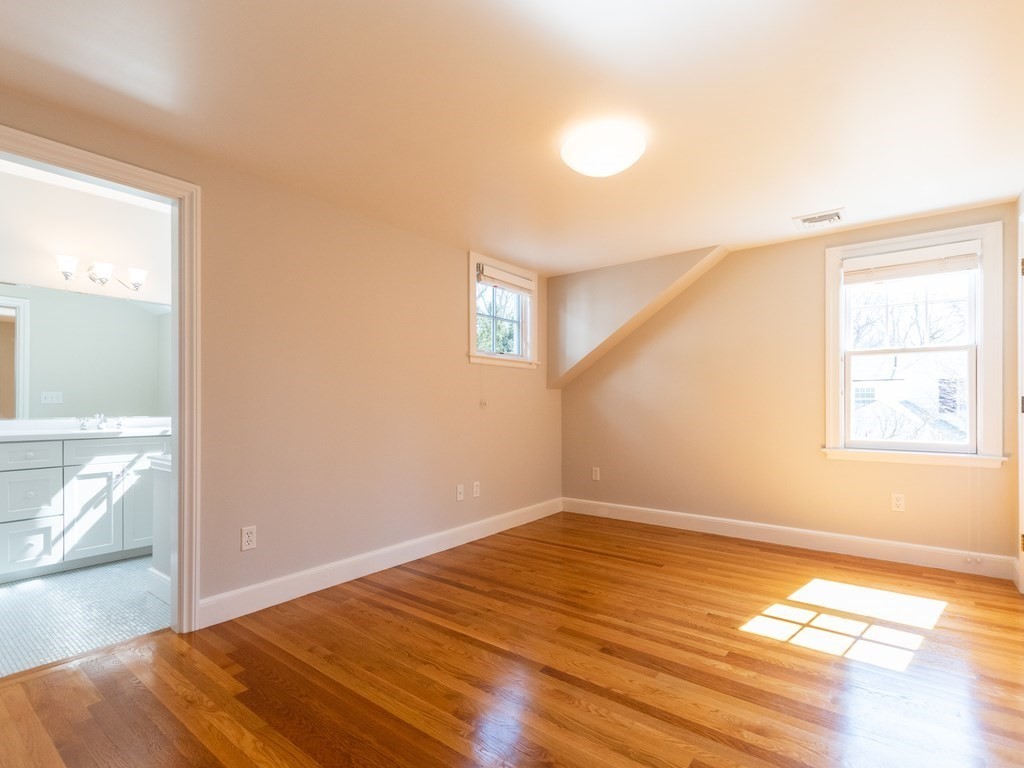 16 Fuller Brook Road Wellesley, MA 02482 - Photo 21 of 36 a view of empty room with wooden floor and fan