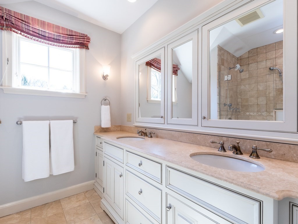 16 Fuller Brook Road Wellesley, MA 02482 - Photo 25 of 36 a bathroom with a granite countertop sink and a mirror
