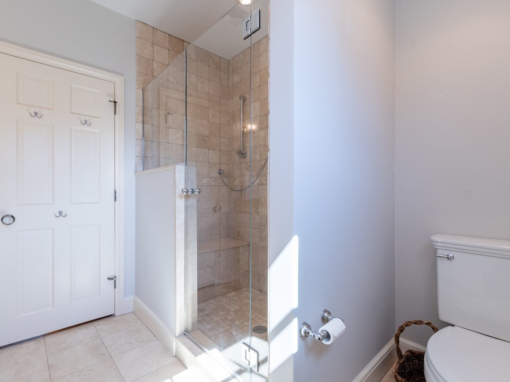 16 Fuller Brook Road Wellesley, MA 02482 - Photo 26 of 36 a bathroom with a shower and a toilet