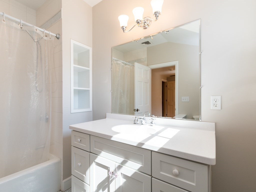 16 Fuller Brook Road Wellesley, MA 02482 - Photo 27 of 36 a bathroom with a sink vanity and a mirror