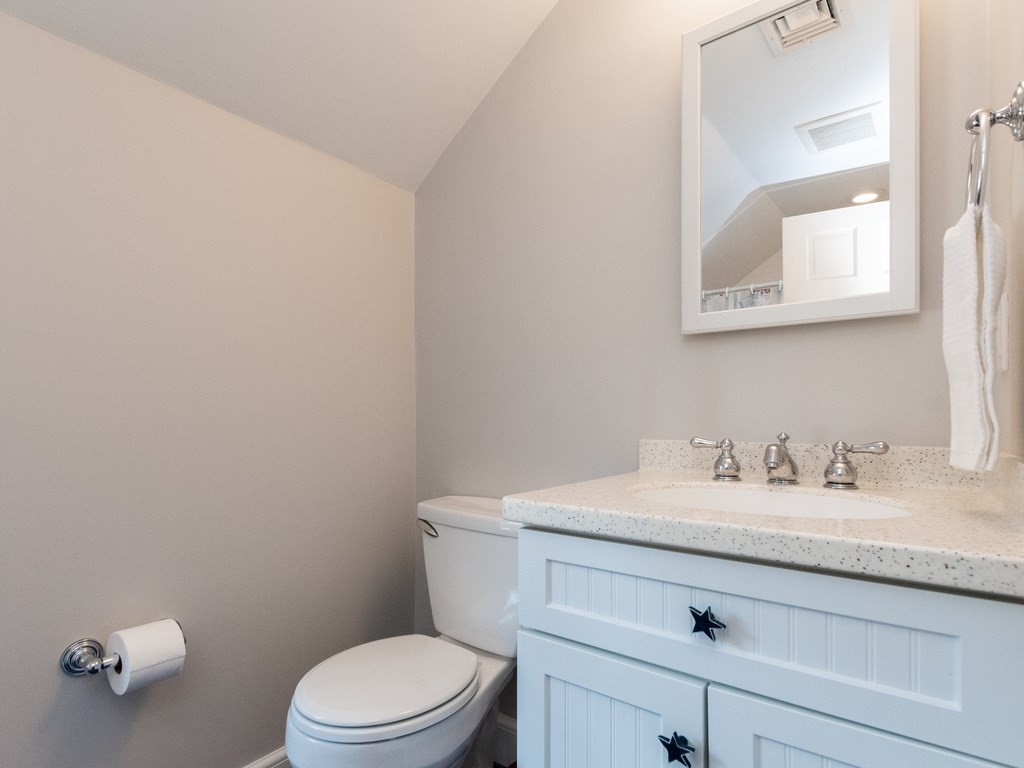 16 Fuller Brook Road Wellesley, MA 02482 - Photo 28 of 36 a bathroom with a granite countertop toilet sink and mirror
