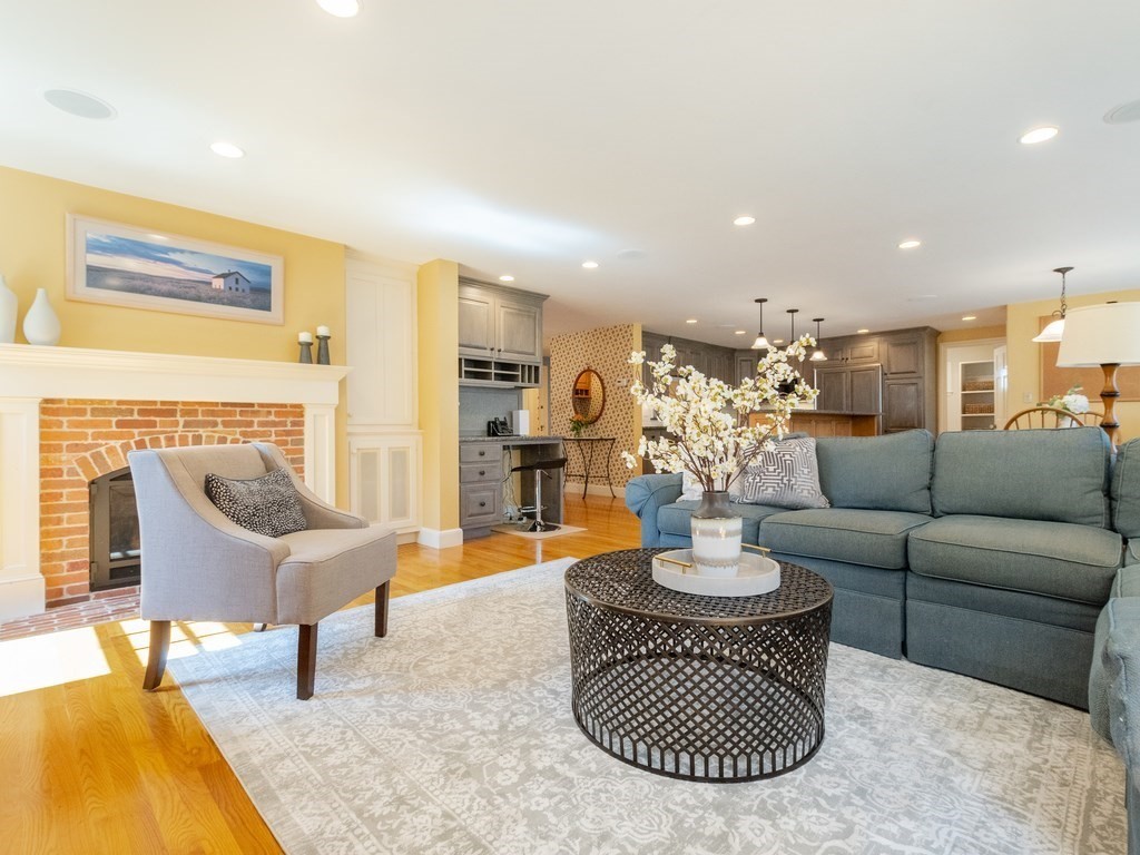 16 Fuller Brook Road Wellesley, MA 02482 - Photo 3 of 36 a living room with furniture and a fireplace