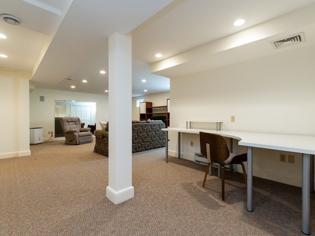 16 Fuller Brook Road Wellesley, MA 02482 - Photo 31 of 36 a living room with furniture and a table