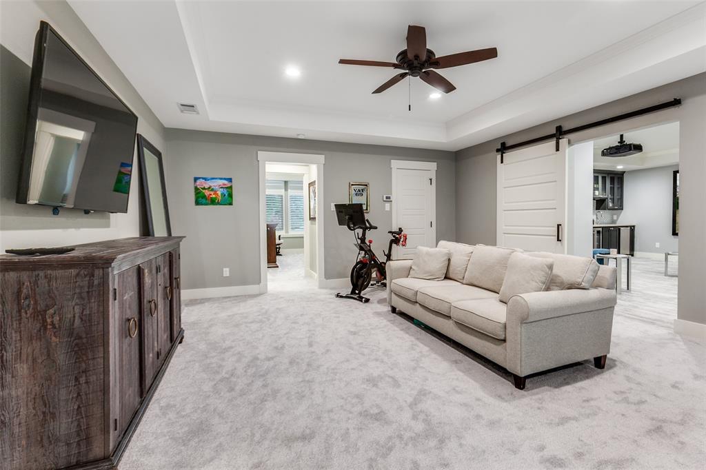 413 Ridge Crest Drive Richardson, TX 75080 - Photo 16 of 34 a living room with furniture and a flat screen tv