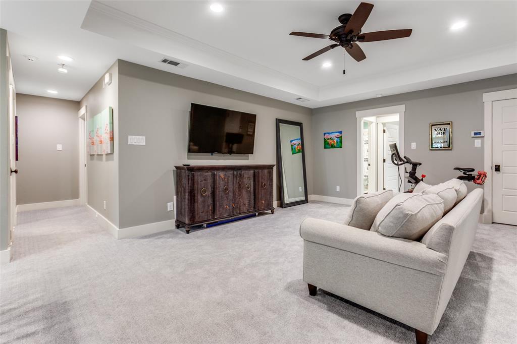 413 Ridge Crest Drive Richardson, TX 75080 - Photo 17 of 34 a living room with furniture and a flat screen tv