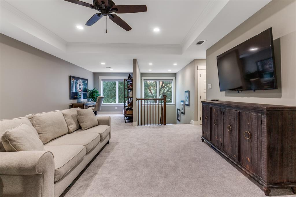 413 Ridge Crest Drive Richardson, TX 75080 - Photo 18 of 34 a living room with furniture and a flat screen tv