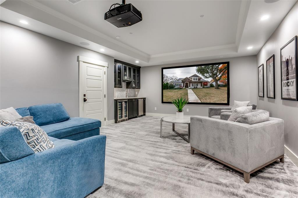 413 Ridge Crest Drive Richardson, TX 75080 - Photo 21 of 34 a living room with furniture and a flat screen tv