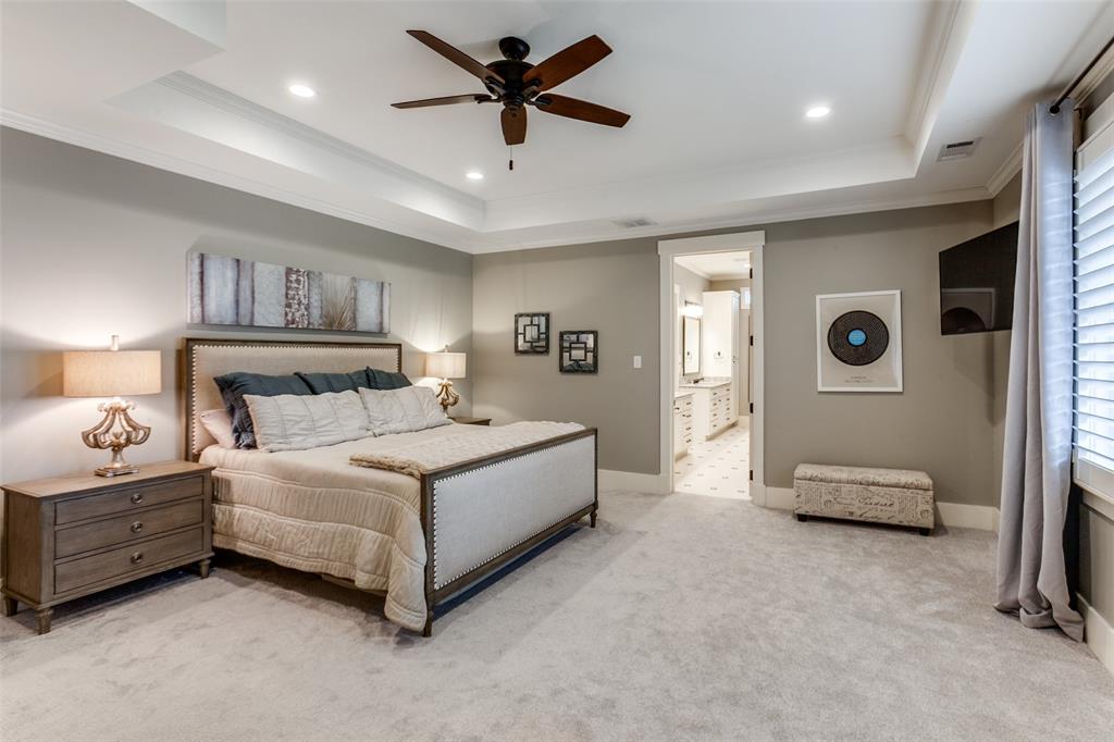 413 Ridge Crest Drive Richardson, TX 75080 - Photo 26 of 34 a spacious bedroom with a bed and a walk in closet
