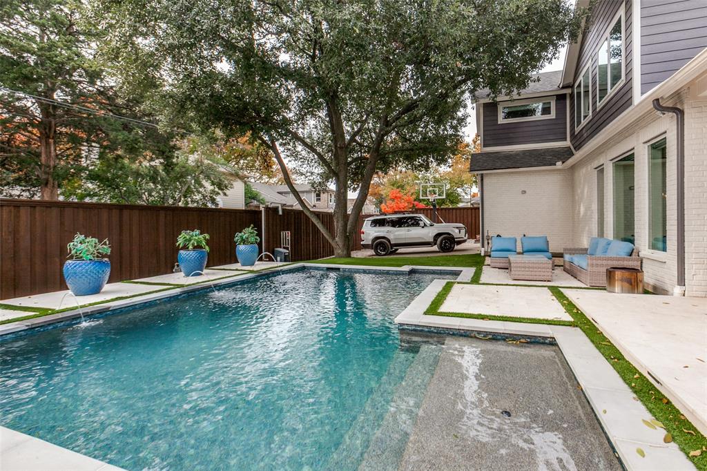 413 Ridge Crest Drive Richardson, TX 75080 - Photo 34 of 34 a view of a swimming pool with a patio