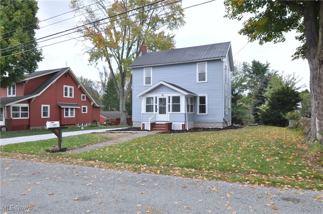 12341 Portage Street Rittman, OH 44270 - Photo 2 of 23 View of front of house with a front yard