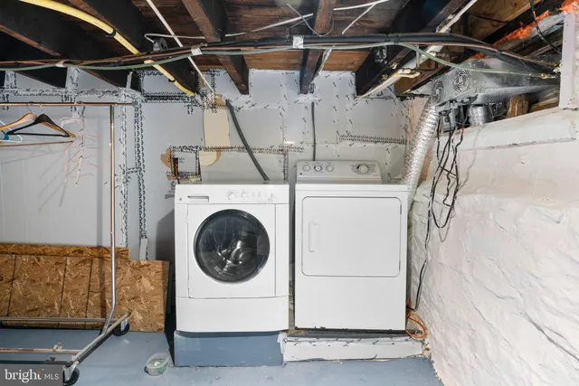 a view of a house with a wooden fence