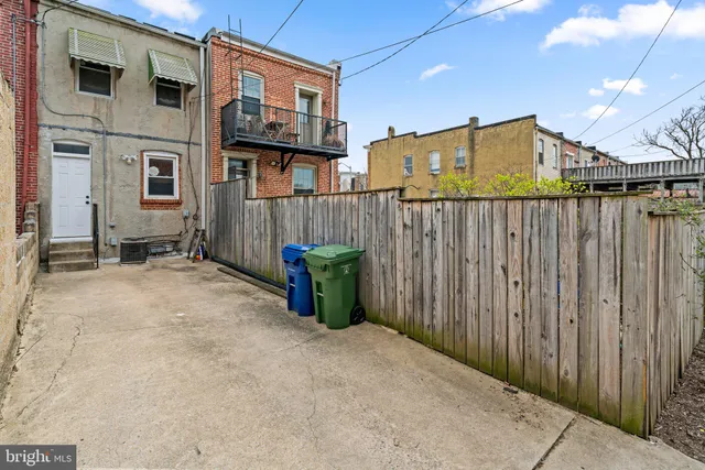 a view of a livingroom with chair and couch