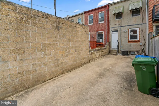 a work room with furniture and rug