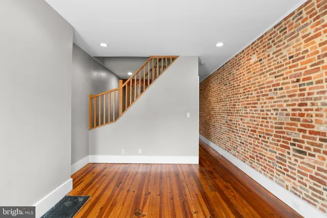 a view of entryway with wooden floor