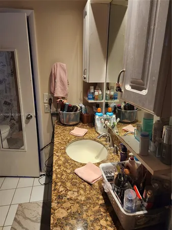 a room with sink and washing machine