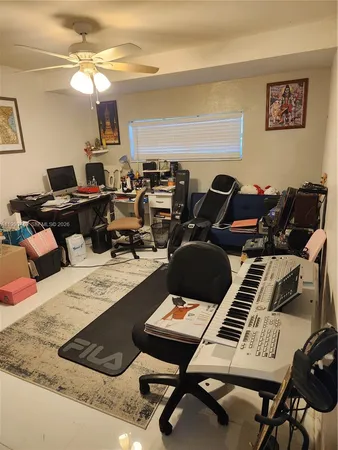 a living room with lots of furniture and a piano