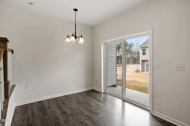 a view of kitchen with cabinets and wooden floor