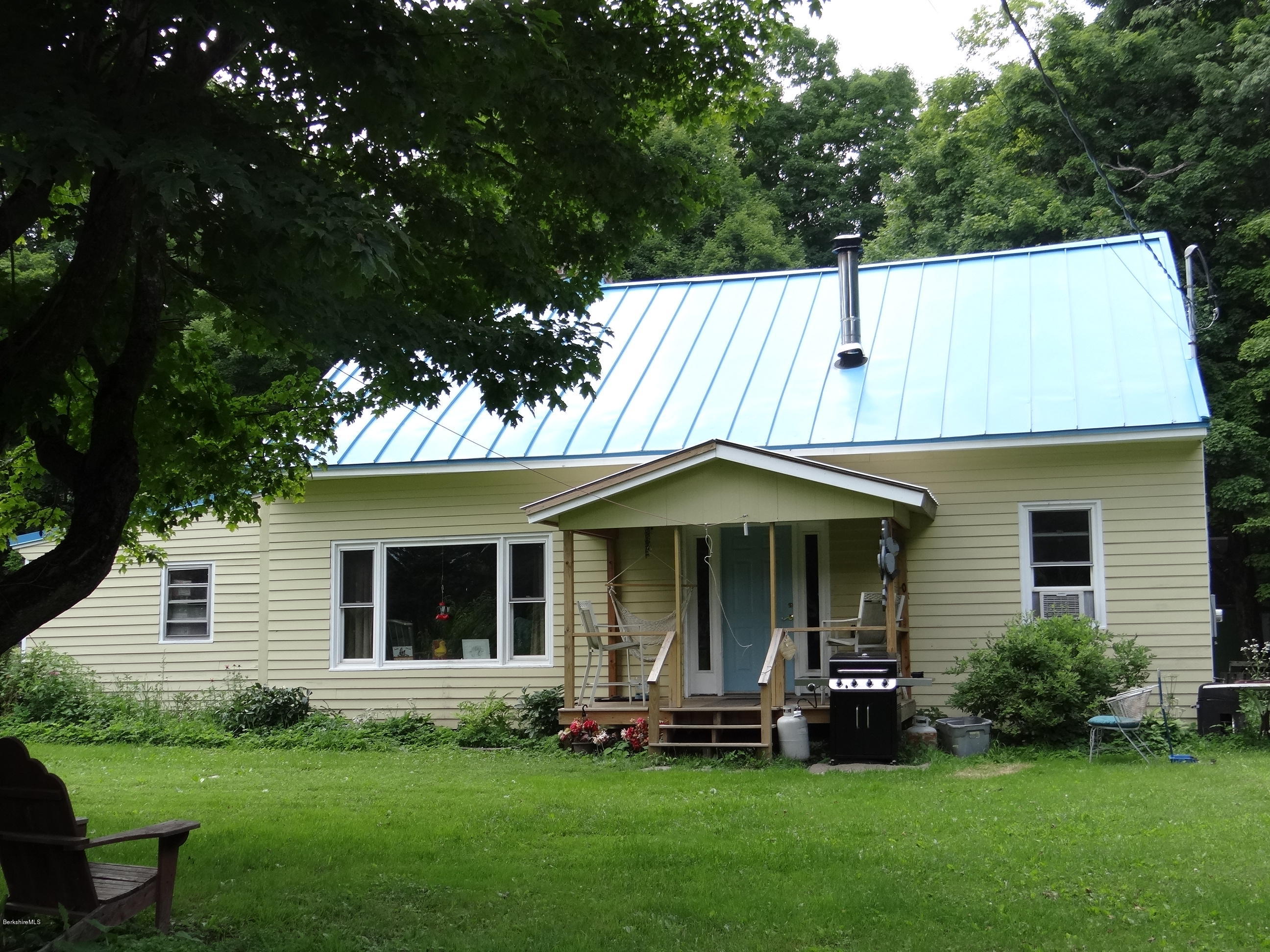 105 Chapel Road Savoy, MA 01256 - Photo 1 of 28 a front view of a house with a yard and porch