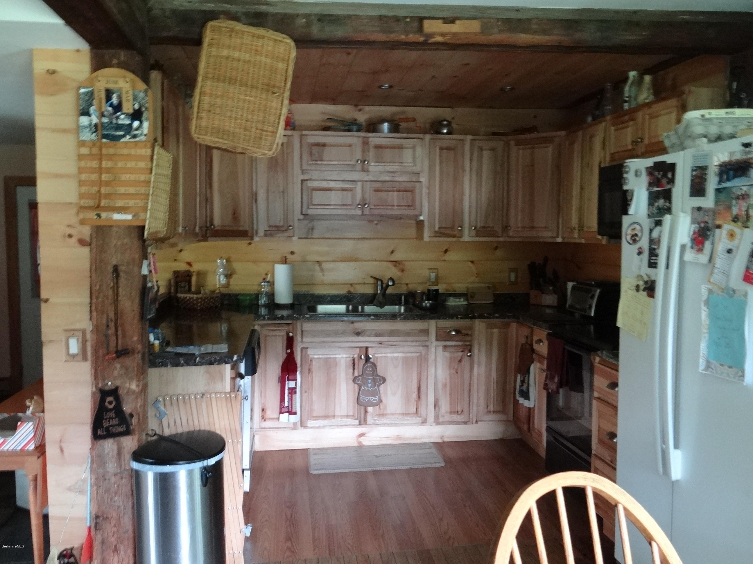 105 Chapel Road Savoy, MA 01256 - Photo 4 of 28 a kitchen with a refrigerator and cabinets