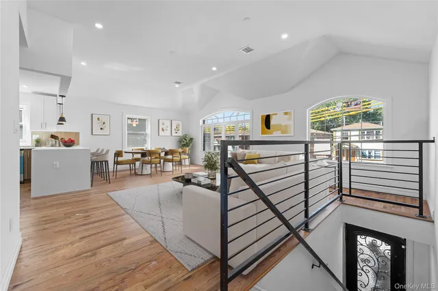 a bedroom with a bed and a potted plant